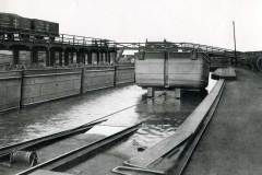 A compartment boat on a rail bogie.
