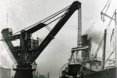 Goole's 50-ton crane tipping coal into a steamship.