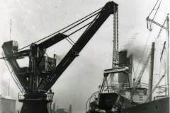Tipping coal into a steamship.