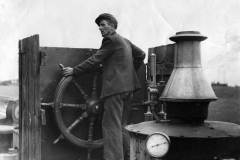 Skipper J W Calvert steering a tug.