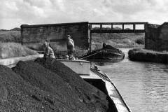 Two coal laden barges under way.