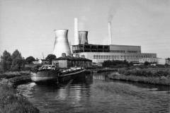A barge passing Dandy Row cottages.