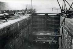 A lock under repair with a Humber keel moored behind.