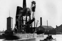 The collier Swandale moored alongside a compartment boat hoist.