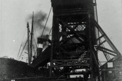 A steam collier alongside No 2 Compartment Boat Hoist.