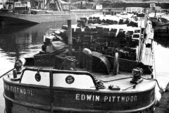 Barge Edwin Pittwood  loaded with timber planks.