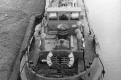 Barge Rufus Stone moored on an elevated stretch of canal.