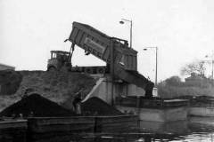 Compartment boats at a coal staithe.