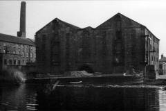 John Hunt alongside a warehouse.