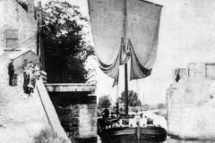 A keel passing through a swing bridge.