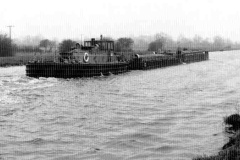 A diesel tug  pushing a pair of barges.