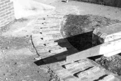 An extended gate arm to assist in moving a heavy canal gate.
