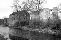 Two derelict canalside buildings.