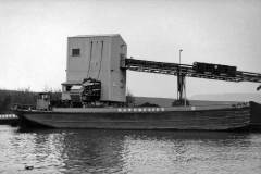 A Hargreaves barge loading coal alongside a colliery staithe.