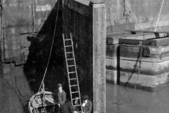 A diver standing on the canal bed.