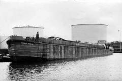 The tanker barge Humber Renown moored at an oil tank farm.
