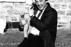 Peter L Smith with a very young baby.