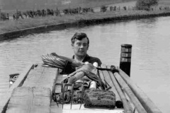 Peter L Smith skippering a narrowboat.