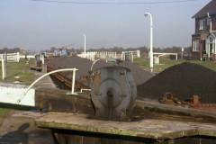 A British Waterways diesel tug leaving a lock.