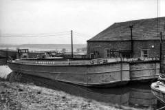 The moored motor barge LAURA.