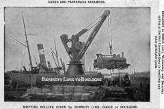 Loading locomotives aboard a Bennett Steamship Co Ltd steamer.