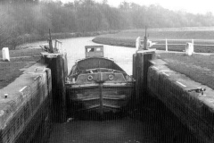 A barge entering a lock.