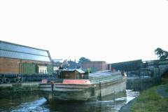 An motor barge approaching a bridge.