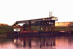 A conveyor loading a barge.