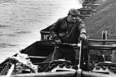 Members of the crew of a compartment boat train.