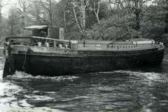 A motor barge winding at  Horbury Curve.