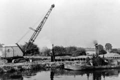 Reinforcing the bank of a canal.