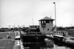 A motor barge in Long Sandall Lock No 13.