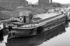 An unladen motor barge.