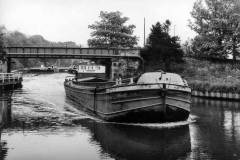 A motor barge leaving Sprotborough Lock.