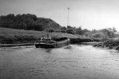 An unladen motor barge.