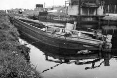 A sunken wooden dumb barge.