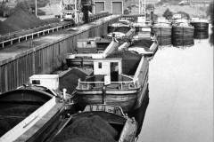 Barges alongside a coal handling facility.