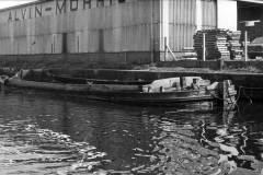 A wooden dumb barge slowly rotting away.