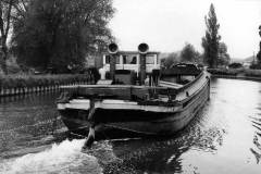 An unladen motor barge.
