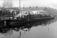 A partially laden tanker barge.