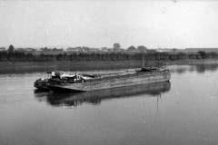 Two motor barges under way.