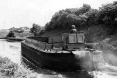 An unladen 'West Country' size motor barge.