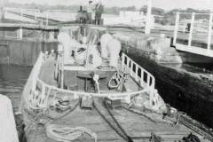 A British Waterways diesel tug in a lock.