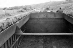 An unladen motor barge under way.