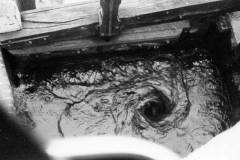 A whirlpool caused by the opening of the gate paddles.