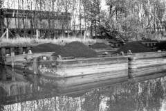 Four listing compartment boats.