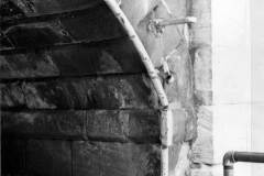 A metal strip protecting a canal bridge.