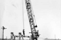 A crawler crane equipped barge.