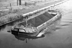 A coal laden motor barge.