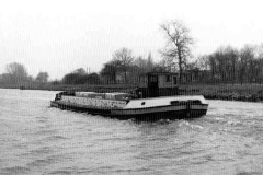 A laden barge under way.